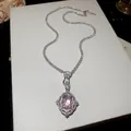 Exquisite detail of a vintage pink gemstone pendant necklace with zirconia tennis chain - Silver-Pink