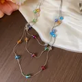Detailed macro view of multi-layered silver chain featuring vibrant faceted glass beads - Single Necklace / Silver - Rainbow