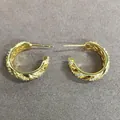 Elegant twisted gold-tone hoop earrings with sparkling pave cubic zirconia stones decoration - Gold
