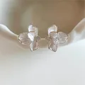 Elegant silver flower earrings with white enamel petals and central zircon stones - White Flower Earrings
