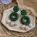 Detailed view of handmade dark green geometric earrings with white baroque pearls - Silver Post-Green-White