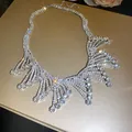 Close-up of glamorous rhinestone fringe necklace with sparkling crystal drops. - Choker Necklace / Silver
