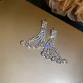 Detail of sparkling rhinestone fringe earrings with elegant hanging fan design - 925 Sterling Silver Pin Stud Earrings / Silver