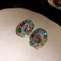 Vintage multi-colored gemstone encrusted stud earrings in an ornate golden setting - Purple-Green