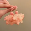Detail view of handmade pink raffia and chiffon flower petal drop earrings for vacation - Style 6 (Steel Pin) / Pink