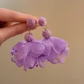 Close-up detail of purple raffia and chiffon flower petal drop earrings for women - Style 7 (Steel Pin) / Purple