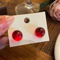 Elegant translucent red resin sphere stud earrings with silver needles for women - Round Style (HE33609-) / Red