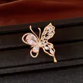 Detailed macro view of an elegant 18K gold plated butterfly earring with sparkling zircons - Ring / Gold-White