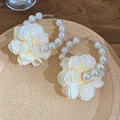 Elegant pearl hoop earrings featuring oversized cream chiffon flowers for a sweet vacation look - Style 52 (Silver Pin) / White