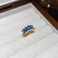 Detail view of square blue zircon ear cuff with 18k gold plating in jewelry box - Single Piece / Gold with Blue Zircon