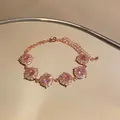 Dettaglio di un elegante bracciale in oro rosa con brillanti pietre di zircone rosa tonde - Bracciale Patchwork Tondo / Oro Rosa-Rosa