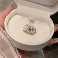 Elegant French style gold-tone ear cuff with large crystal and white pearl in a white jewelry box - Pearl Style (HE33116) / Single Piece / Pearl Gold