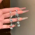 Elegant long tassel earrings featuring light blue zircon flower petals for women - Flower Tassel Style / 925 Silver Needle / Silver-Blue