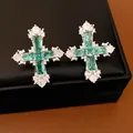Luxurious emerald green gemstone cross earrings with sparkling cubic zirconia accents - Stud Earrings / Silver-Green