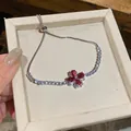 Elegant silver chain flower bracelet with vibrant red zircon stones presented in a gift box - Bracelet / Rose Red