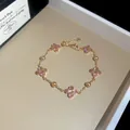 Élégant bracelet plaqué or rose avec trèfles à quatre feuilles en zircon rose - Trèfle Rose en Micro-Pavé (55#) / Rose (55#)