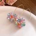 Close-up of colorful flower ball drop earrings with golden hooks for summer - Ear Hook Flower Ball Style / Gold-Multicolor