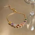 Elegant 14k gold-plated bracelet featuring vibrant multi-color cubic zirconia stones - Adjustable Bracelet / Gold-Multicolor