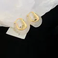 Close-up detail of U-shaped jelly resin earrings in a minimalist and elegant Korean style - White