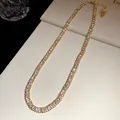 Detail view of a luxury double-row crystal choker necklace with gold-tone plating - Necklace / Gold