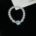 Eleganter Perlenarmband im französischen Stil mit herzförmigem blauem Edelsteinanhänger - Silber Weiß Blau