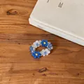 Premium Korean style blue and white flower beaded bracelet on a wooden table setup - Ring / Blue-White