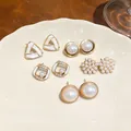 Detailed view of five-pair pearl and rhinestone geometric earring set - Geometric Pearl Style Combination / Gold