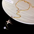 Elegant gold-plated hand chain with zircon flower detail for women - Gold