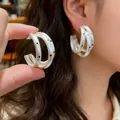 Elegant minimalist multilayer silver C-shaped earrings with decorative black polka dots - Silver (Silver Pin)