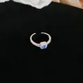 Close-up of elegant silver open ring with square blue gemstone and white zircon halo. - Open Ring-Silver-Blue