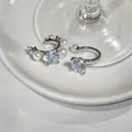 Detailed macro shot of elegant French-style zircon and pearl non-pierced ear cuffs. - Silver (1 Pair)