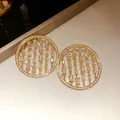 Close-up of gold hollow circular earrings with sparkling square zircon stones - Golden Round Hollow Style (41#)