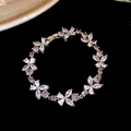 Macro view of elegant flower zircon bracelet featuring sparkling pink and clear crystals - Flower Bracelet / White-Purple