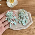 Detailed view of mint green floral tassel earrings with pearlescent teardrop beads - Flower Tassel Style (HE32829) / Blue