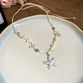 Handmade bohemian starfish necklace with pearls and turquoise beads on adjustable cord - Starfish Pendant Style / White