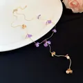 Elegant purple enamel flower tassel necklace with delicate gold-plated chain details. - Gold And Purple