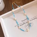Detailed view of bohemian beaded necklace with crystal beads and starfish charms - Necklace-Blue