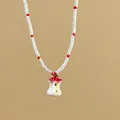 French style white and red beaded necklace with a unique apple core pendant design - Apple Core Pendant / White-Red