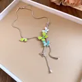 Detailed shot of silver lariat necklace with colorful enamel butterfly pendants - Butterfly Pendant Necklace / Green/Blue