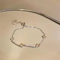 Elegant silver-toned zircon flower bracelet with adjustable slider clasp for women - Hollow Clover Style (HB5459)