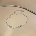 Elegant silver-toned zircon flower bracelet with an adjustable slider clasp for women - White Bow Flower Style (HB5459)