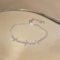 Elegant silver-tone bracelet featuring pink zirconia flower charms and adjustable slider - Pink Marquise Zirconia Flower Style (HB5459)