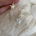 Orecchini a goccia stella marina stile isola con cristallo trasparente e fiore d'argento - Stile Ciondolo Stella Marina Fiore (HE34311) / Bianco (Gancio Argento)