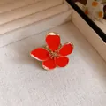 Close-up of retro red enamel flower open ring with exquisite gold stamen detail - Red