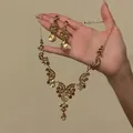 Elegant champagne crystal necklace and earring set held by hand against beige - Hollow Lace Jewelry Set (9#)