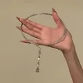 Hand holding silver-toned choker with cascading teardrop crystal pendants - Multiple Teardrop Pendant Style (15#)