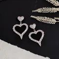 Detailed view of hollow heart-shaped earrings with iridescent pavé rhinestones - Silver Needle-Silver-AB Iridescent