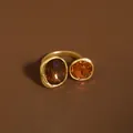 Exquisite detail of a matte gold open ring featuring brown oval crystals in Maillard style - Gold Brown