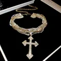 Sparkling rhinestone multi-layered choker necklace with a large cross pendant. - Gold
