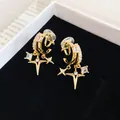 Detailed macro view of 18k gold plated zircon star ear clips on black velvet background - Double Layer Star Clip-on / Gold